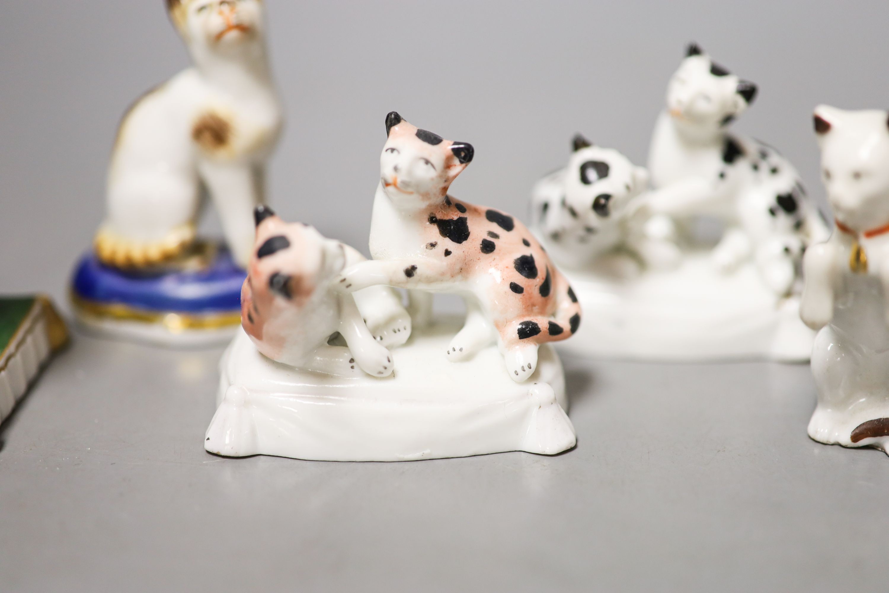 Six French porcelain cat figures or groups, and a similar sheep figure, late 19th century